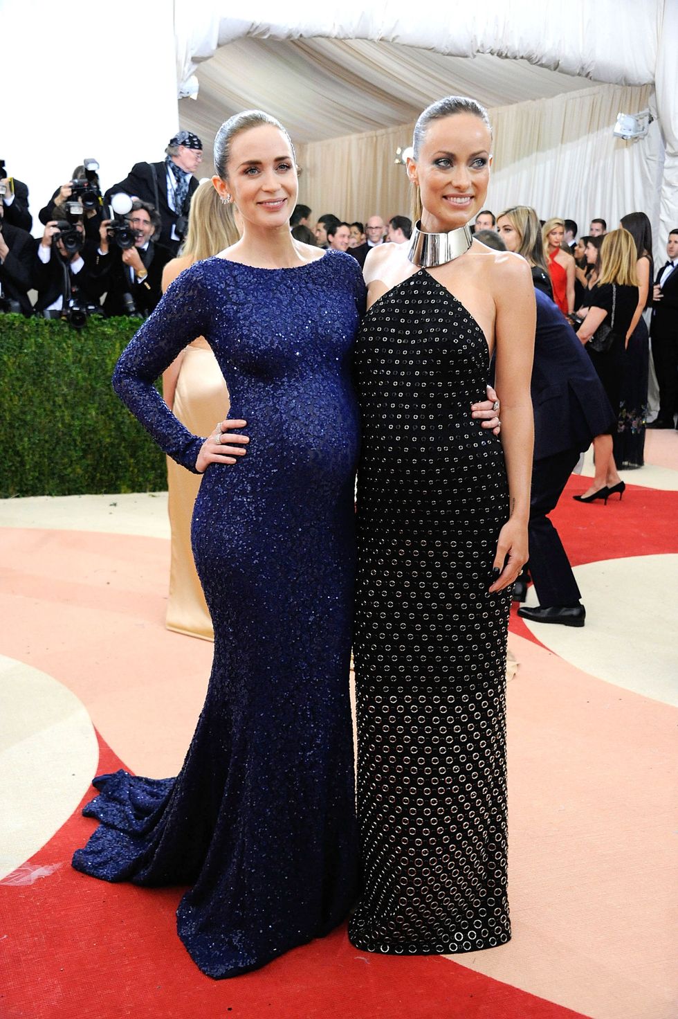 <p>This photo! Wouldn't even have been possible decades ago because pregnancy = you've got to go into hiding! Here, we've got two glowing women&nbsp;in coordinating Michael Kors dresses, one of whom is having so much fun playing with fashion, including cutouts (on an expectant mother—shocking!). &nbsp;</p>