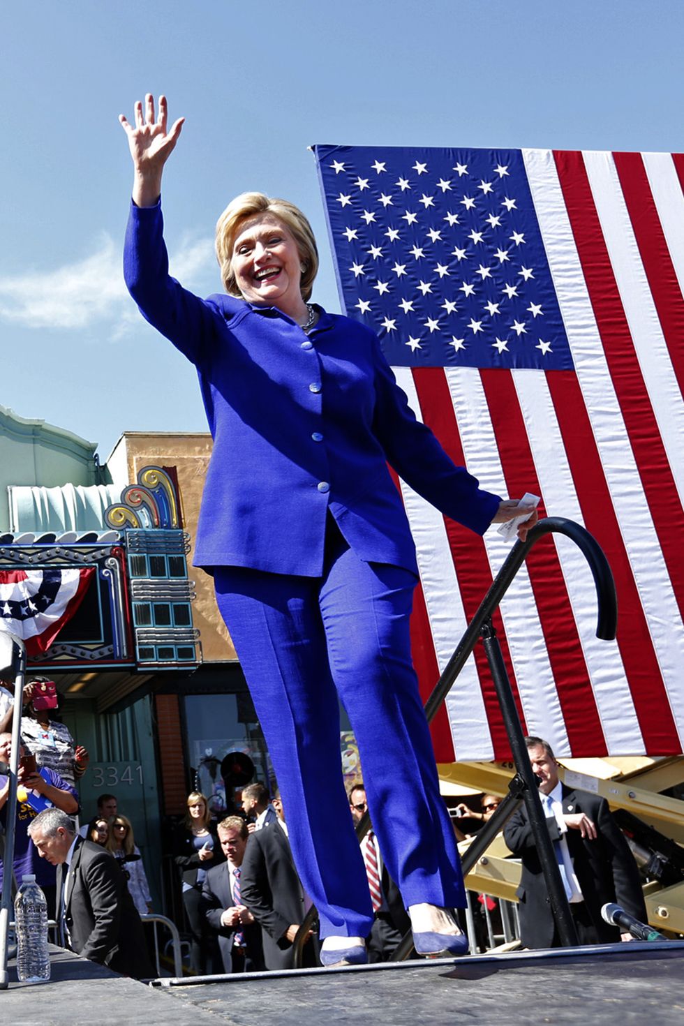 Flag of the united states, Flag, Electric blue, Flag Day (USA), Blond, Independence day, Pantsuit, Active pants, Gesture, Laugh, 