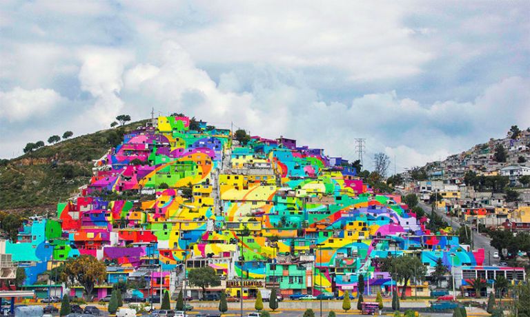 <p>This district in&nbsp;Mexico commissioned the street art group German Crew to paint the town a <a href="http://www.housebeautiful.com/lifestyle/a4059/colorful-neighborhood/" target="_blank">rainbow of colors</a>, resulting in what looks like a large and mesmerizing mural.</p>
