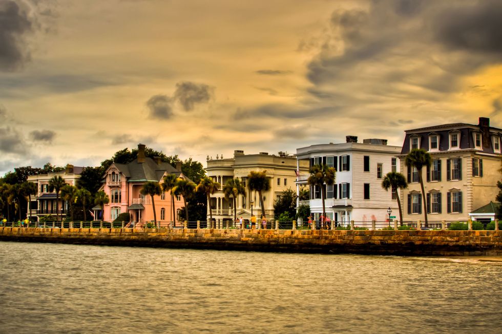 <p>For a relaxing, affordable getaway that celebrates rich history and fine taste, look no further than Charleston — it's one of the friendliest, most hospitable places in the country, making it perfect for those traveling alone for the first time. The cobblestone streets and horse-drawn carriages make you feel like you're in another realm, and that sentiment is only furthered when you stay at&nbsp;<a href="http://thespectatorhotel.com/" target="_blank"><u data-redactor-tag="u" data-tracking-id="recirc-text-link">The Spectator</u></a>, an upscale boutique hotel that oozes a lively 1920s ambiance thanks to the speakeasy-esque bar, personal butlers, and flapper-loving decor. You'll want those butlers to work their magic, too: Not only will they craft a personalized itinerary perfect for those heading out solo, but they'll also accompany you if you decide you don't want to do something totally by yourself.&nbsp;</p><p><br></p><p>You'll be staying just one block from the culture-infused&nbsp;<a href="http://www.thecharlestoncitymarket.com/" target="_blank"><u data-redactor-tag="u" data-tracking-id="recirc-text-link">Charleston City Market</u></a>, and a 10-minute drive from&nbsp;<a href="https://www.charlestonsfinest.com/sc/exclusking.htm" target="_blank"><u data-redactor-tag="u" data-tracking-id="recirc-text-link">King Street</u></a>, one of the country's most historic shopping streets that's filled with everything from national clothing chains and locally-owned boutiques to art galleries and interior-design and furniture shops. Plan your trip so it lands on the second Sunday of the month and take part in&nbsp;<a href="http://www.charlestoncitypaper.com/charleston/second-sundays-on-king-street/Event?oid=2342609" target="_blank"><u data-redactor-tag="u" data-tracking-id="recirc-text-link">Second Sundays on King</u></a>, when the street closes to cars so shoppers can roam free and then enjoy lunch outdoors while listening to live street performances.</p>