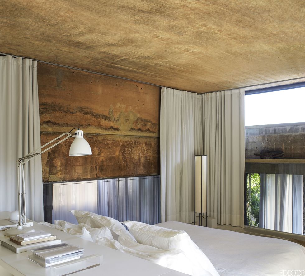 <p>Spanish architect Ricardo Bofill transformed an abandoned cement factory in Barcelona into his home, using mottled concrete salvaged from the building for the master bedroom walls.</p>