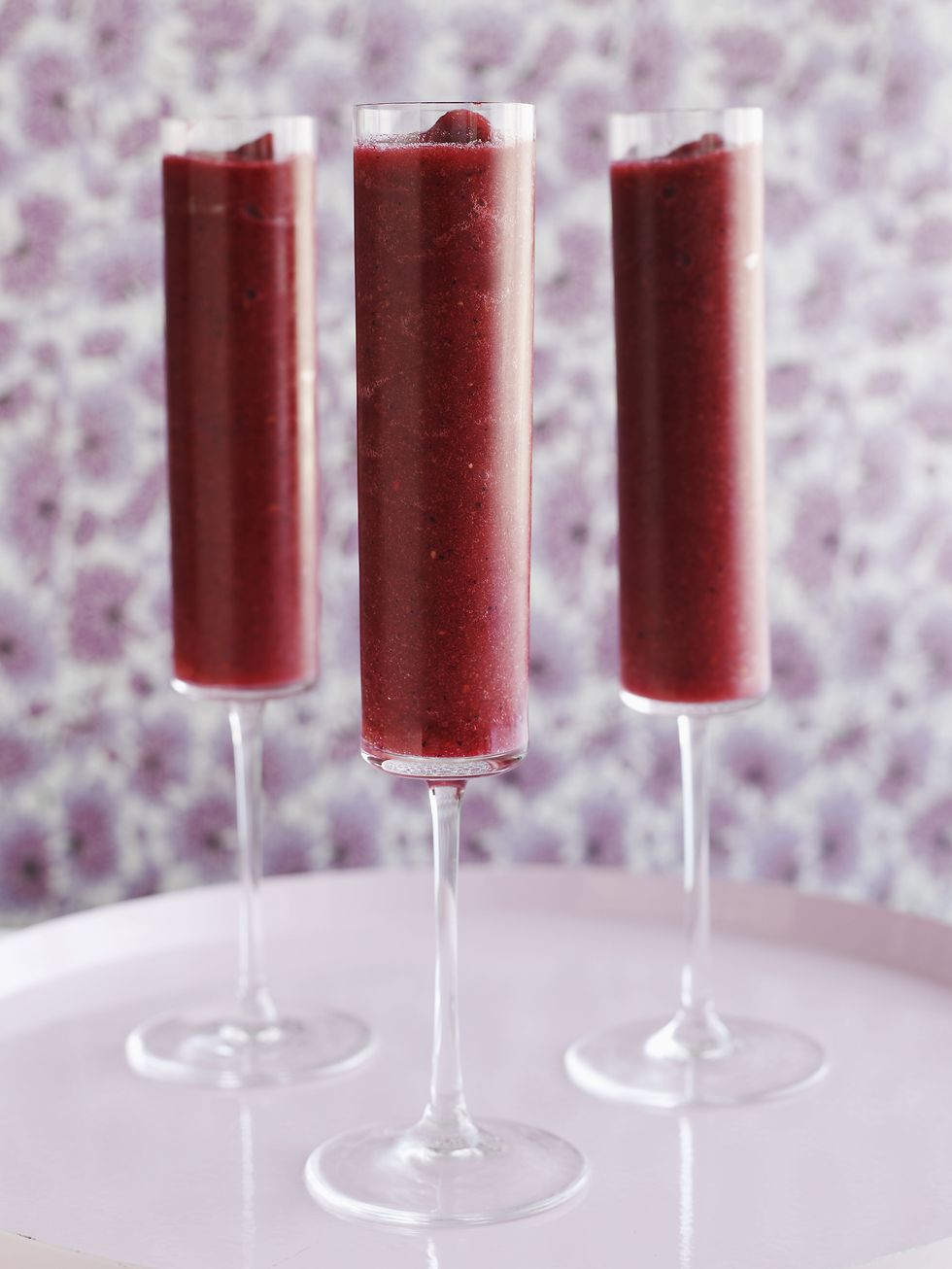 <p>A <a href="http://www.foodnetwork.com/recipes/paula-deen/mixed-berry-bellinis-recipe.html">better-than-popsicles recipe.</a></p><p><strong>Ingredients: </strong></p><p>1 (12-oz.) Package Frozen Mixed Berries, thawed</p><p>1/4 cup Sugar</p><p>1 (750 ml) Bottle Sparkling Wine or Prosecco<br><br><strong>Directions: </strong></p><p>In the container of an electric blender, combine berries and sugar; process until smooth. Strain mixture, if desired. Pour fruit mixture into a serving pitcher; slowly add wine, stirring gently to combine.<br></p>