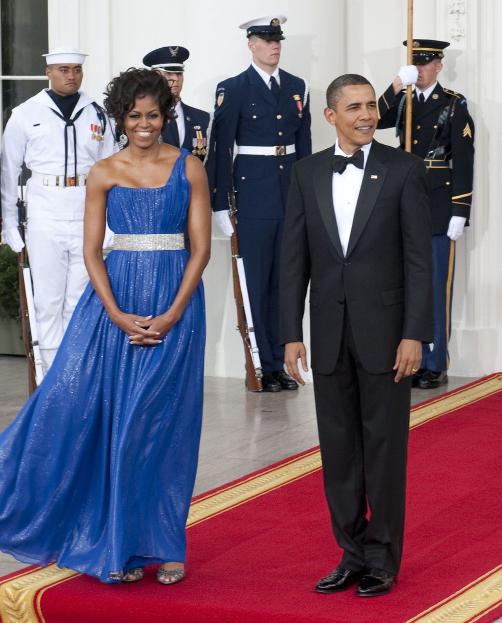 <p>          <strong data-verified="redactor" data-redactor-tag="strong">When: </strong>May 19, 2010</p>

<p><strong data-verified="redactor" data-redactor-tag="strong">Where: </strong>At the White House State Dinner, waiting to welcome Mexican President Felipe Calderon and Mrs. Margarita Zavala</p>

<p><strong data-verified="redactor" data-redactor-tag="strong">Wearing: </strong>Peter Soronen one-shouldered gown</p>

<p><strong data-verified="redactor" data-redactor-tag="strong"></strong><strong data-verified="redactor" data-redactor-tag="strong">Why it mattered: </strong>To host Mexican president Felipe Calderon, Michelle chose an one-shouldered blue shimmering gown by Peter Soronen. "Michelle's evening style was particularly glamorous, but it was glamorous as defined by Hollywood and red carpets and not as defined by the traditions of the White House," notes Givhan.  </p>