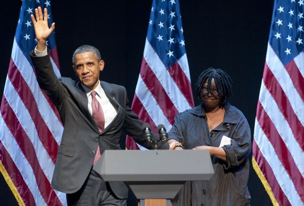 <p>Obama holds Goldberg's hand as he waves to the crowd at a special 2011 fundraising performance of the Broadway musical <i data-redactor-tag="i"><a href="http://www.broadway.com/shows/sister-act/">Sister Act</a></i> in New York on behalf of the Democratic National Committee. </p>