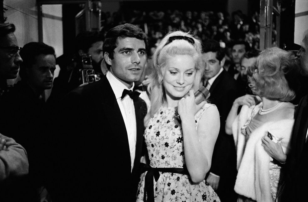 <p>Catherine Deneuve—the hands-down queen of hair bows—at the Cannes Film Festival in 1964.</p>