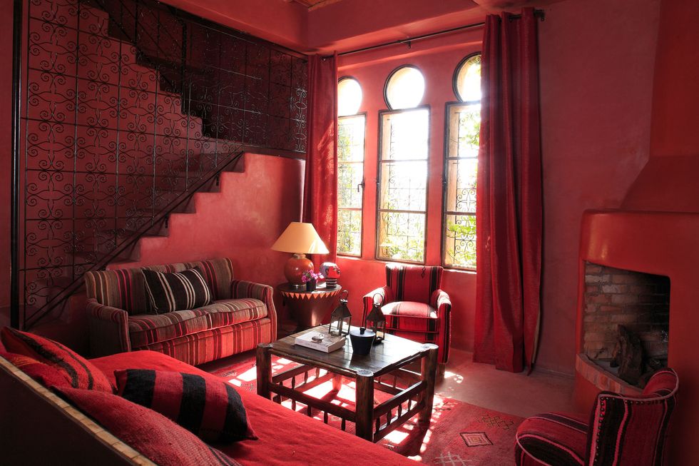 Room, Interior design, Living room, Red, Floor, Furniture, Table, Couch, Wall, Home, 