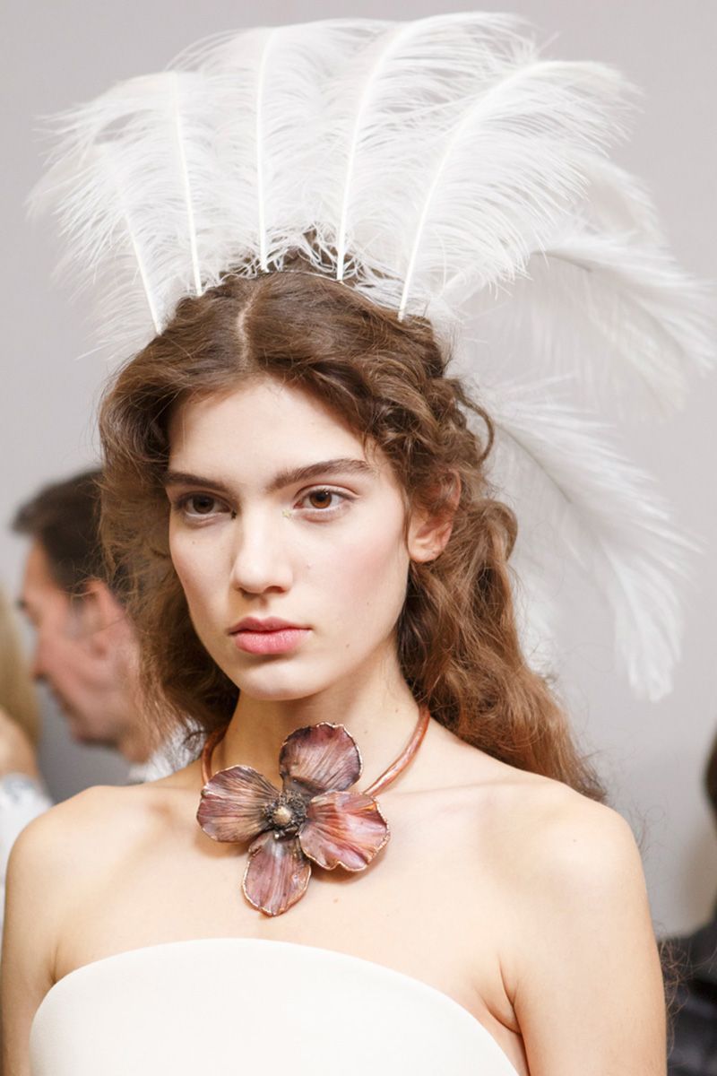 <p>Magic was in the air at the Dior couture show. That translated to&nbsp;models walking&nbsp;through the overgrown garden-maze setting in black hooded robes, masks shaped like insects, and feathered headdresses sticking out of ethereal curls.&nbsp;</p>