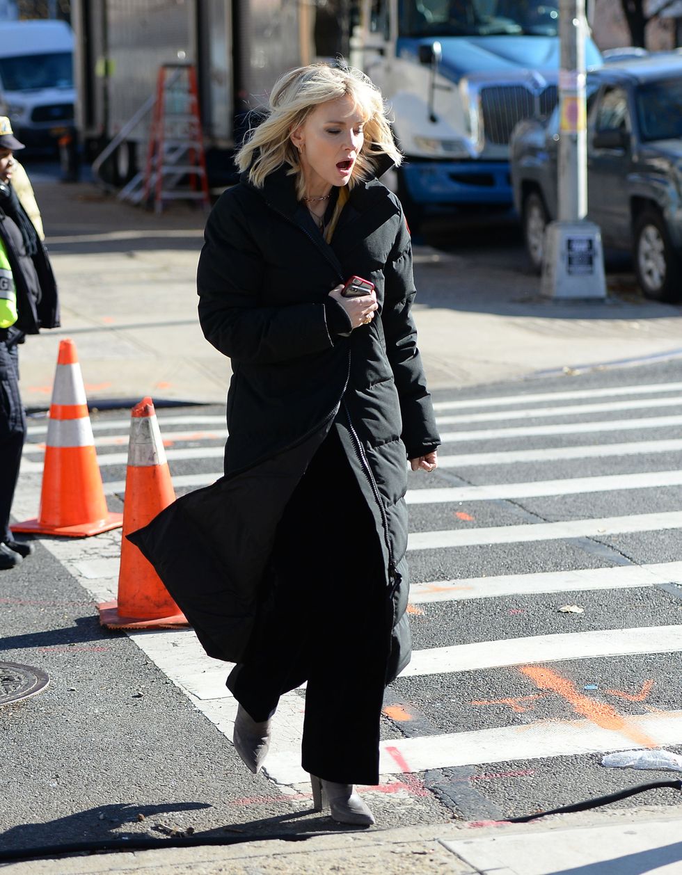 <p>Even with wind-blown hair and full-length puffer, still looks a queen.</p>