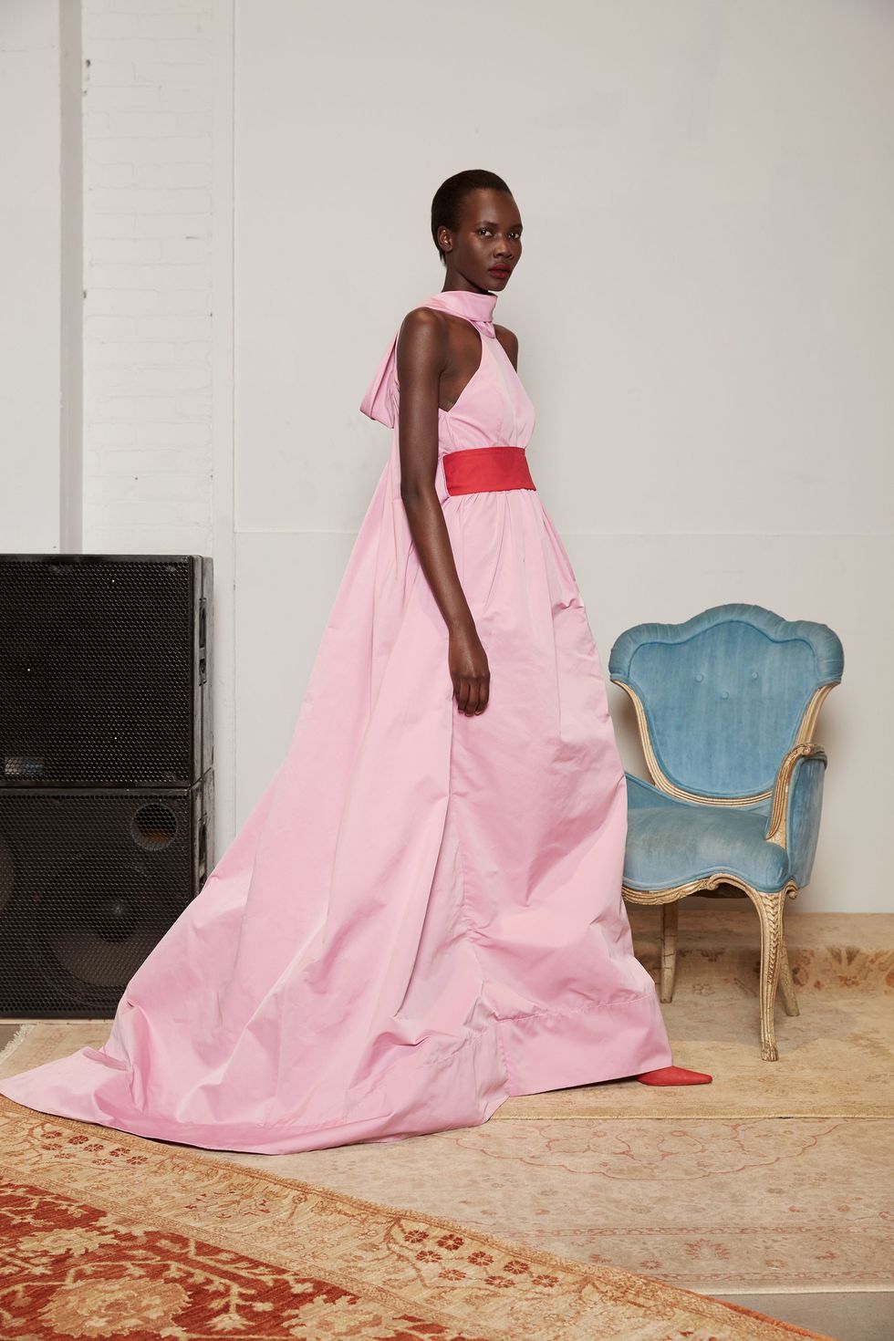 <p>Easy: pink! It's still soft and pretty, but the formerly reserved-for-girls color has&nbsp;recently taken on a new significance too. For whatever reason you wear it, Rosie Assoulin's halter gown is the ultimate.&nbsp;</p>