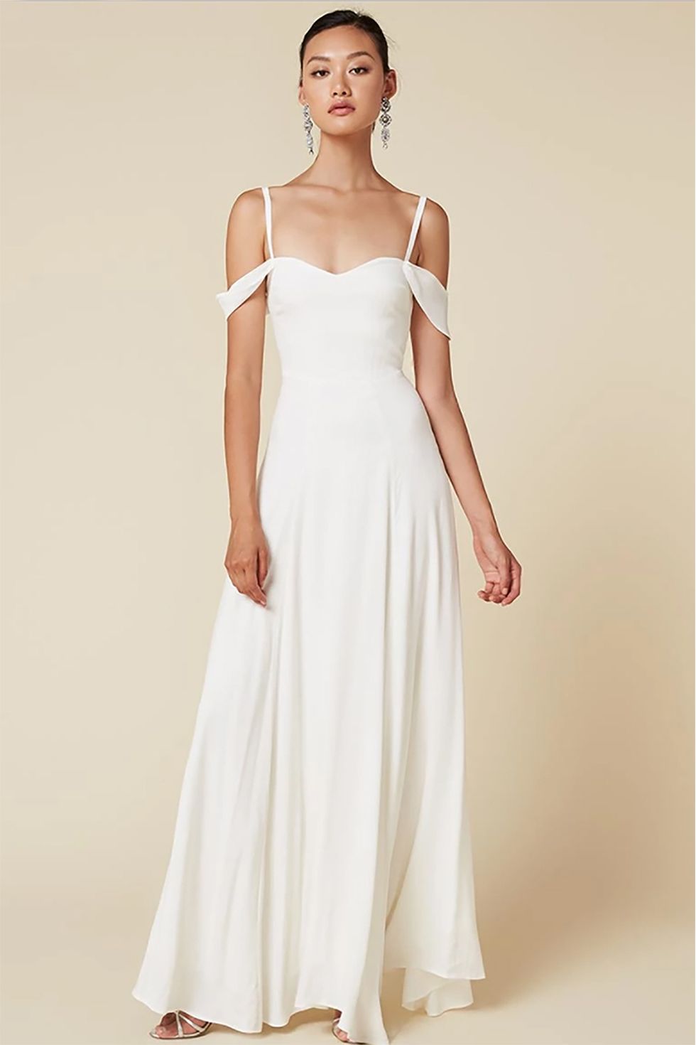 <p>If Reformation were a girl, she would be *ya* girl, because she's always got your back. Lots of their floor-length models come in ivory, like this remarkably versatile, vaguely classical&nbsp;minuet of a dress.&nbsp;</p><p>$388, <a href="https://www.thereformation.com/products/poppy-dress-ivory" target="_blank" data-tracking-id="recirc-text-link">thereformation.com</a>.</p>