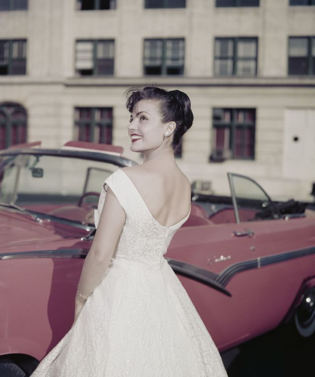 Hairstyle, Eye, Window, Shoulder, Dress, Photograph, Bridal clothing, Fender, Classic car, Gown, 
