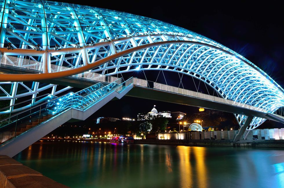 Metropolitan area, Bridge, Landmark, Night, Architecture, Light, Skyway, Lighting, Water, Urban area, 