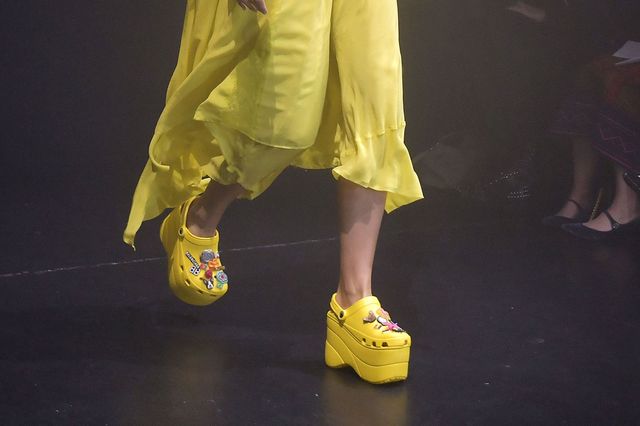 Yellow, Footwear, Human leg, Shoe, Leg, Fashion, Joint, Performance, Human body, Fun, 