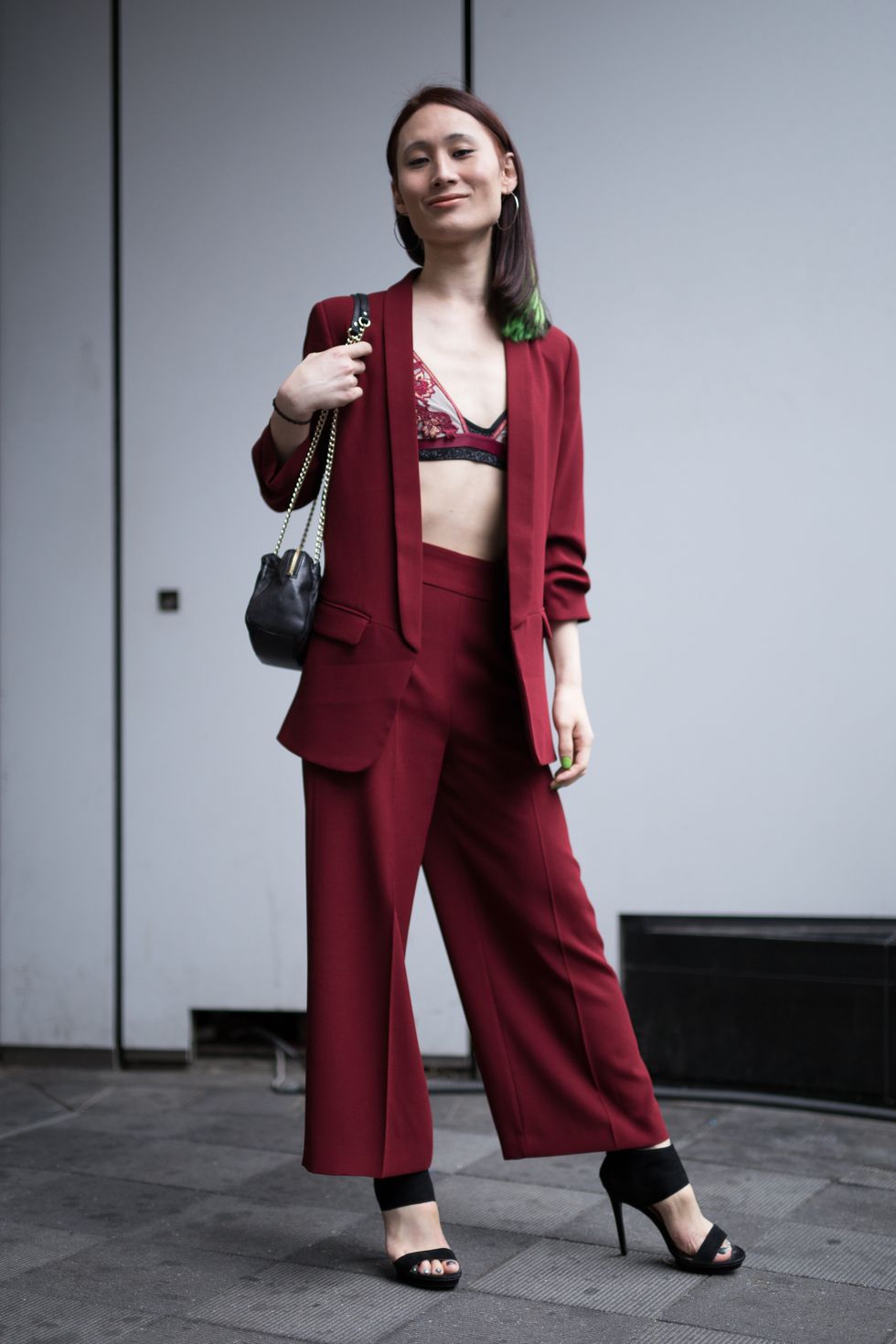 Clothing, Fashion model, Red, Formal wear, Fashion, Suit, Shoulder, Maroon, Standing, Pantsuit, 