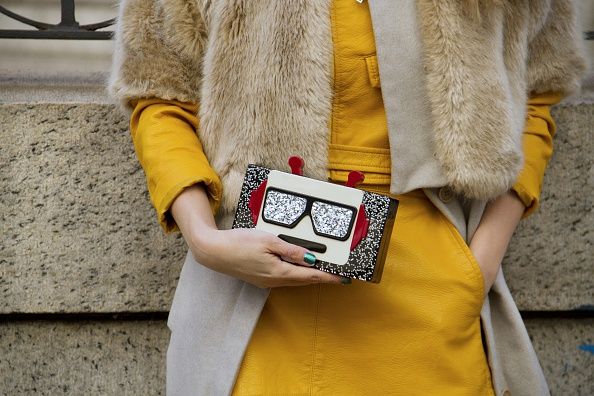 Yellow, Textile, Communication Device, Fashion, Street fashion, Fur clothing, Natural material, Wrist, Fur, Mobile device, 