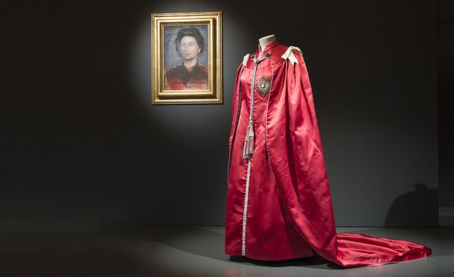Textile, Red, Picture frame, Magenta, Costume design, Maroon, Gown, Silk, Visual arts, Haute couture, 