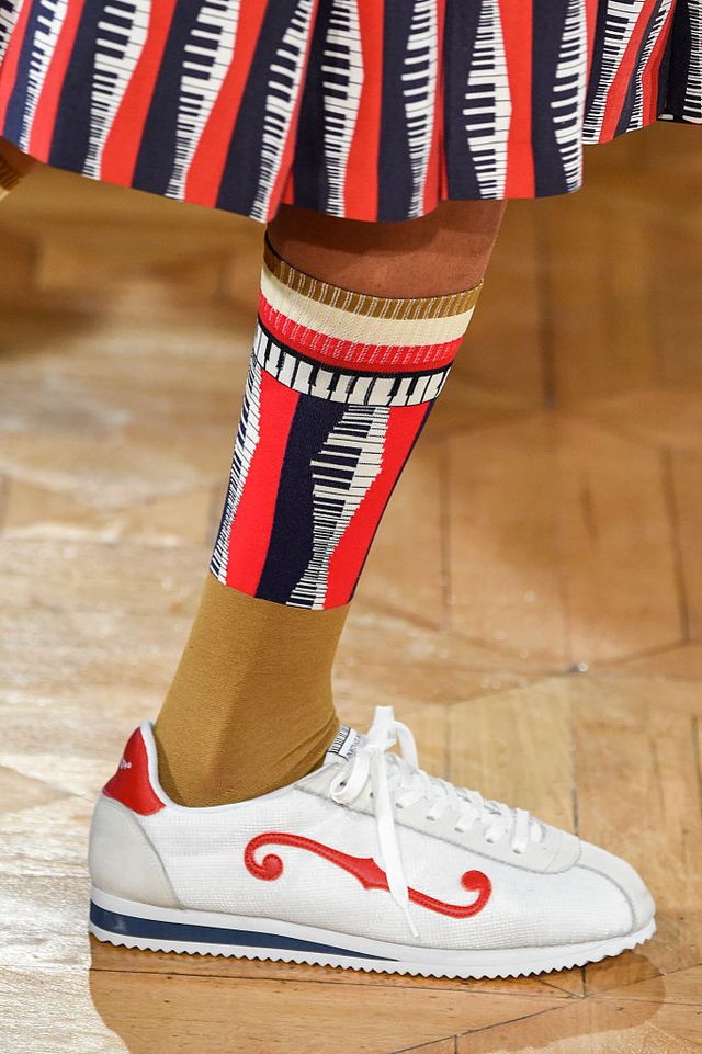 Carmine, Logo, Maroon, Sock, Walking shoe, Ice hockey equipment, Balance, 