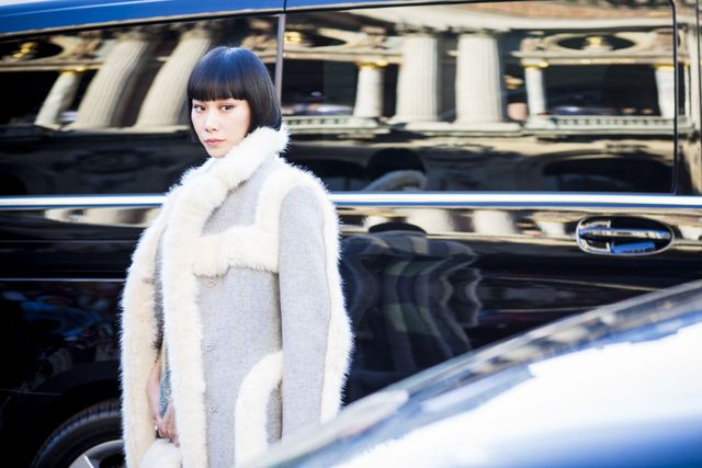 Transport, Textile, Winter, Fur clothing, Automotive exterior, Street fashion, Grille, Black hair, Bangs, Electric blue, 