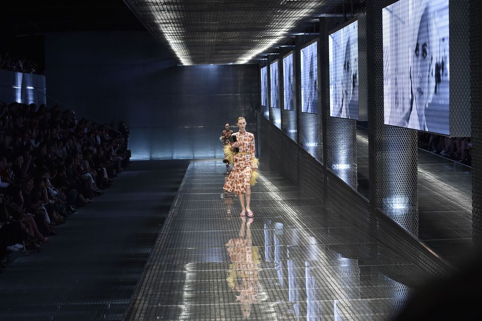 Dress, Hall, Shadow, Symmetry, Aisle, Transparent material, Fashion model, Runway, Haute couture, Day dress, 