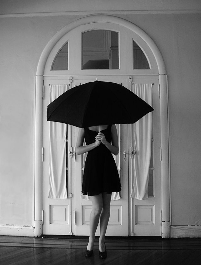 Clothing, Umbrella, Human leg, Standing, White, Dress, Style, Monochrome, Waist, Black, 