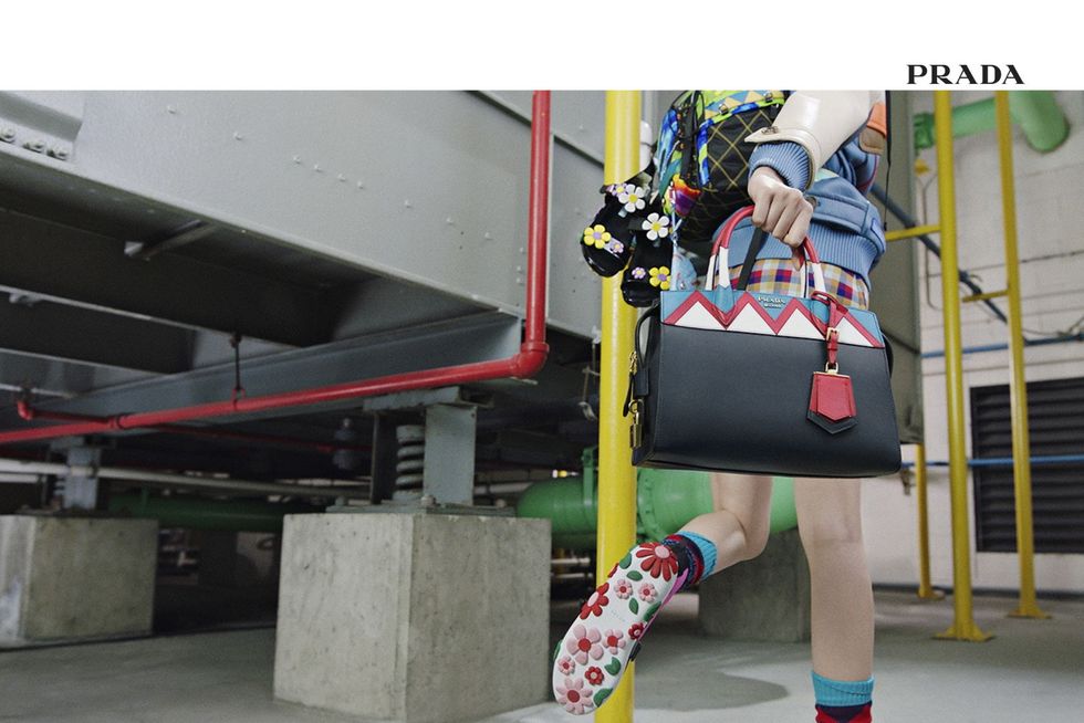 Bag, Fictional character, Concrete, Street fashion, Knee, Composite material, Baggage, Sock, 