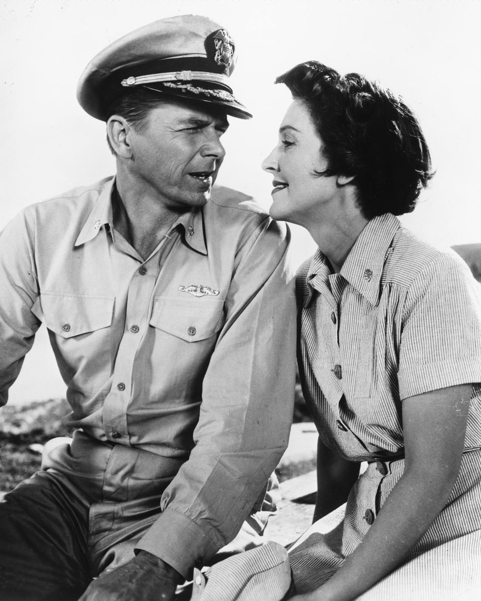 Married American actors Ronald Reagan (1911 - 2004), as Commander Casey Abbott, and Nancy Davis (Nancy Reagan) as Nurse Lt. Helen Blair in 'Hellcats Of The Navy', directed by Nathan Juran, 1957. This is the only film the couple made together. (Photo by Silver Screen Collection/Getty Images)
