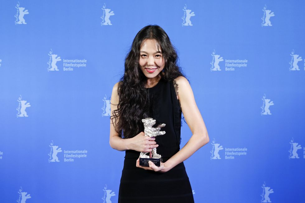 BERLIN, GERMANY - FEBRUARY 18:  Actress Kim Min-hee poses with her Silver Bear for Best Actress (On the Beach at Night Alone) backstage after the closing ceremony of the 67th Berlinale International Film Festival Berlin at Berlinale Palace on February 18, 2017 in Berlin, Germany.  (Photo by Carsten Koall EPA - Pool/Getty Images)