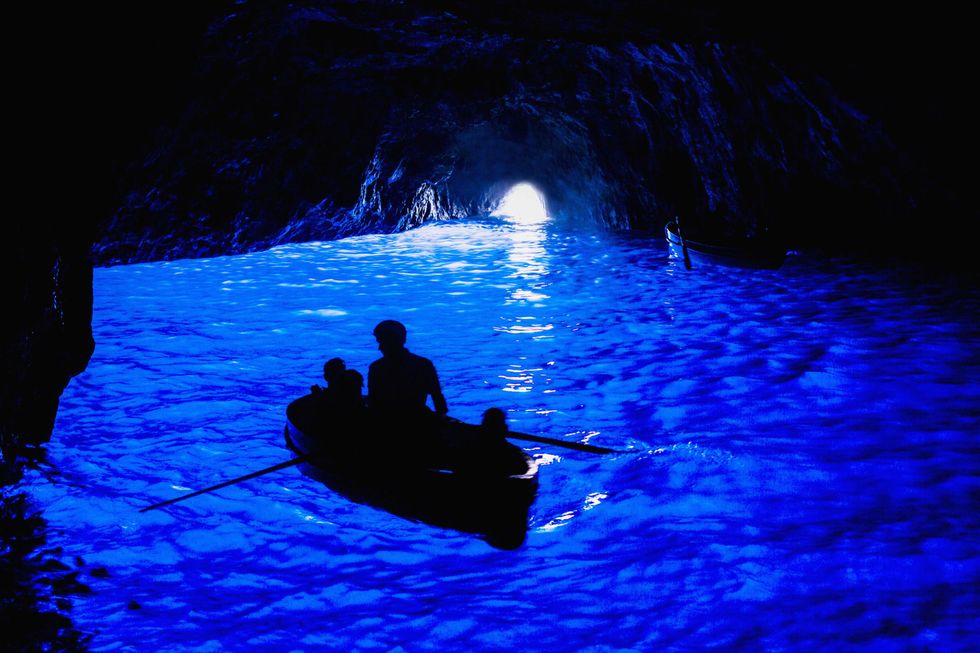 Blue, Darkness, Water, Electric blue, Cave, Recreation, Sea cave, Space, Boating, 