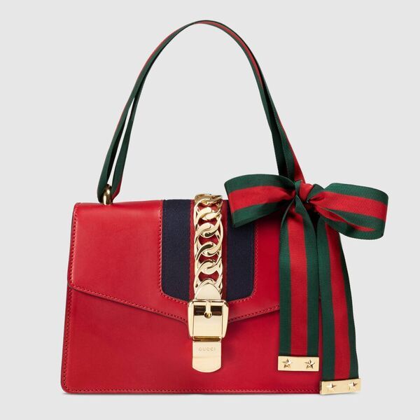 Product, Bag, Red, Fashion accessory, Style, Font, Shoulder bag, Carmine, Strap, Luggage and bags, 
