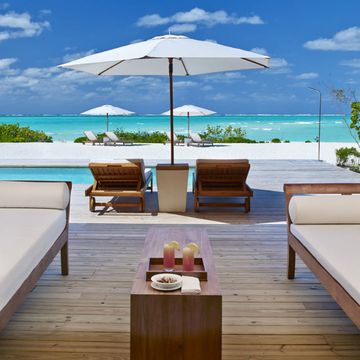 Property, Furniture, Vacation, Ocean, Deck, Room, Caribbean, Sky, Umbrella, Outdoor furniture, 