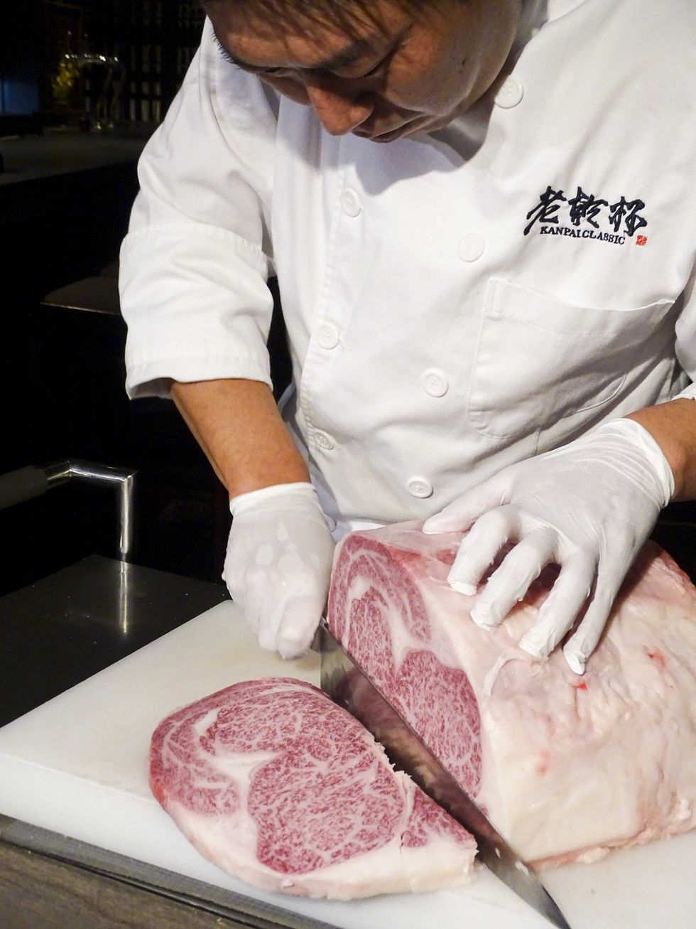 Kobe beef, Red meat, Animal fat, Food, Salt-cured meat, Cuisine, Meat cutter, Flesh, Butcher, Meat carving, 