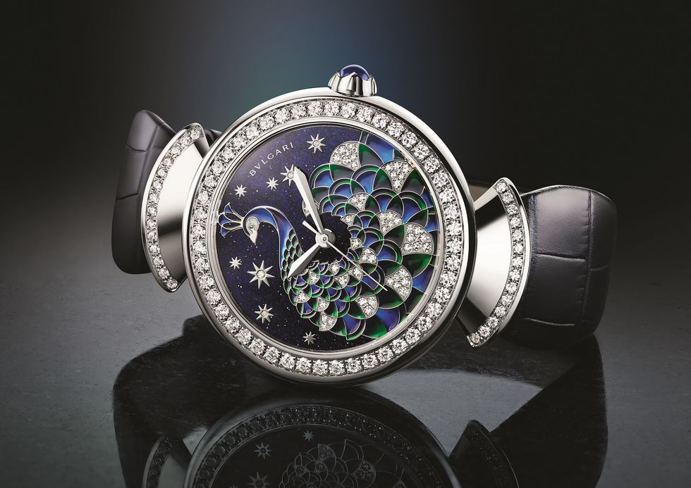 Fashion accessory, Watch, Jewellery, Diamond, Analog watch, Gemstone, Watch accessory, Silver, Brand, Strap, 