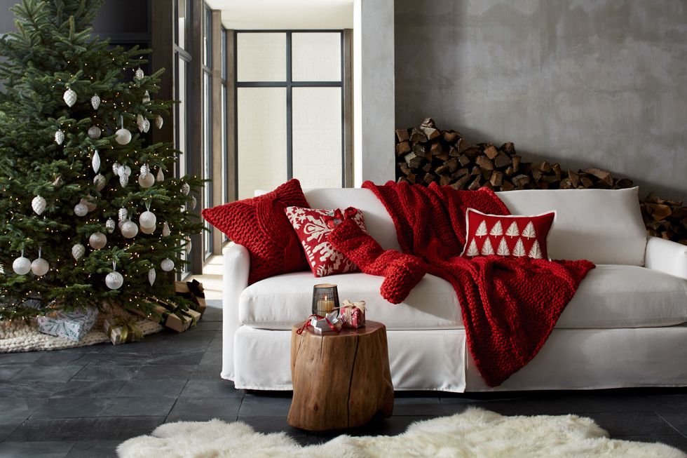 Living room, Christmas decoration, Furniture, Room, Couch, Interior design, Red, Home, Christmas stocking, Christmas tree, 