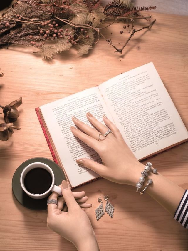 Hand, Cup, Nail, Book, Coffee cup, Finger, Writing, Photography, Publication, Fashion accessory, 