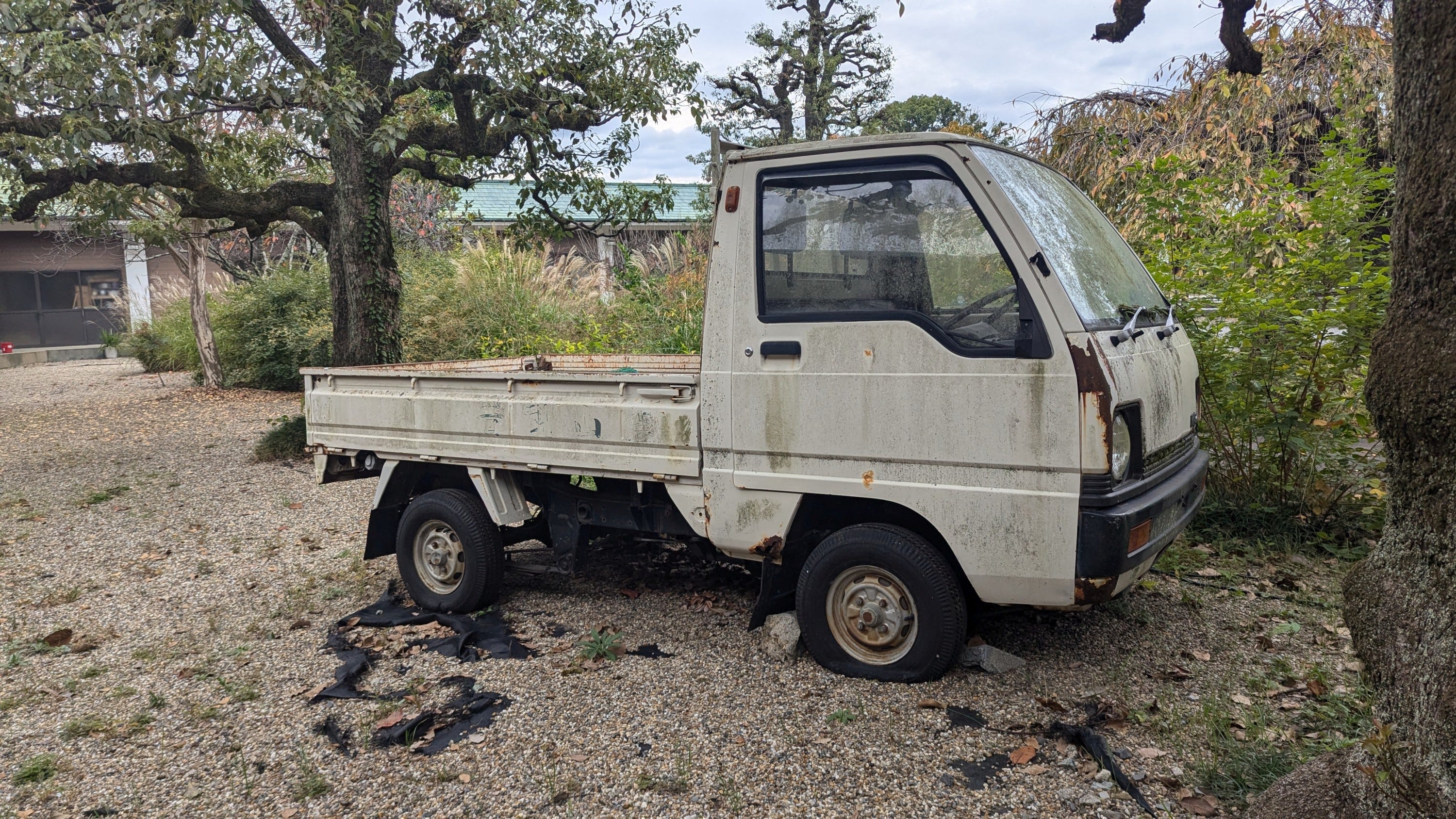 1980s Mitsubishi Minicab Truck Rusts Contemplatively at Kyoto Temple