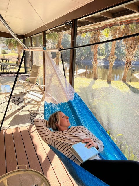 woman resting in hammock using hive hammock stand