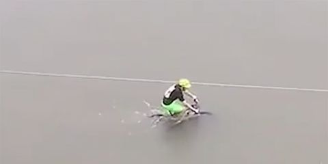 Cyclist riding through flooded Houston streets after Hurricane Harvey. 