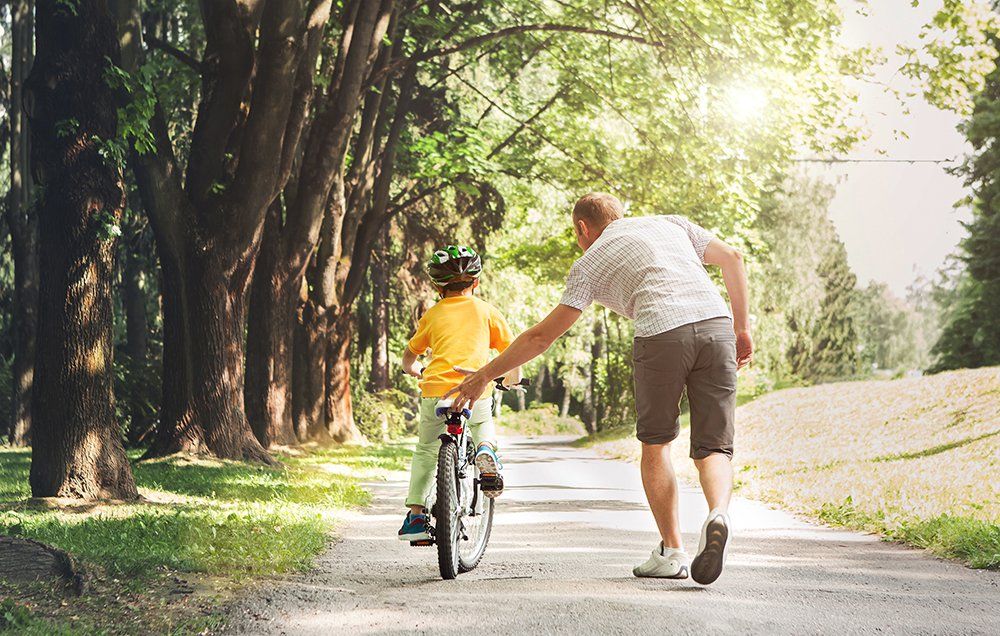 teach child to ride bike without training wheels