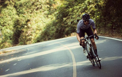 Cyclist Sprinting Up A Road Cyclist Sprinting Up A Road