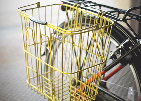 Bicycle tire, Bicycle wheel rim, Yellow, Bicycle accessory, Bicycle basket, Rim, Bicycle front and rear rack, Iron, Bicycle, Spoke, 