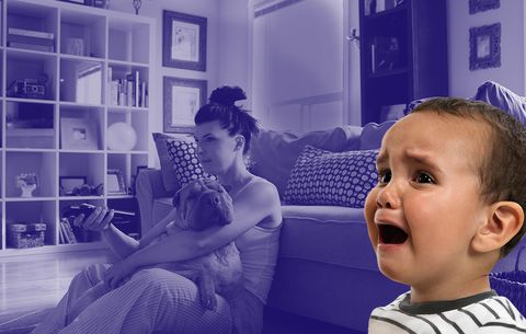 Baby crying and parent holding a dog and watching TV