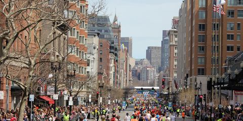 Runners head down Boylston Street toward the Boston Marathon finish line.