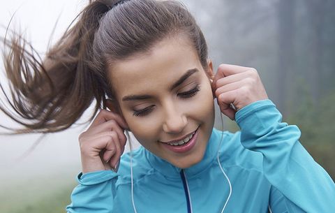 Woman listening to headphones