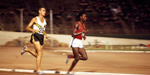 Gold medalist Naftali Temu of Kenya leads silver medalist Ron Clarke of Australia in the 6-mile event during the British Empire and Commonwealth Games in Kingston, Jamaica, on August 6, 1966. 