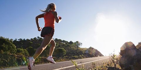 Woman running up hill