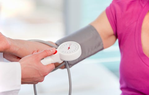 Woman getting blood pressure checked