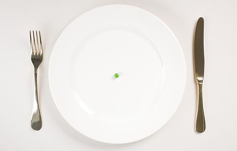 Empty plate except for pea