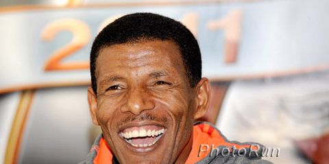 Haile Gebrselassie laughing with mic