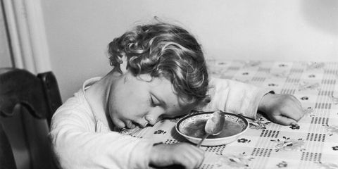 Child asleep at the dinner table