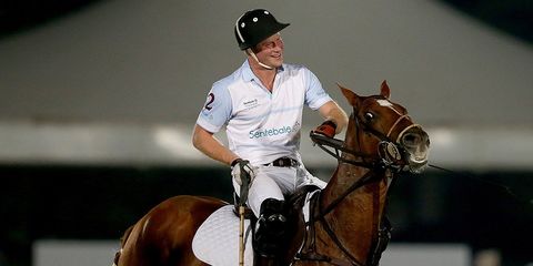 Prince Harry during polo match on a horse 